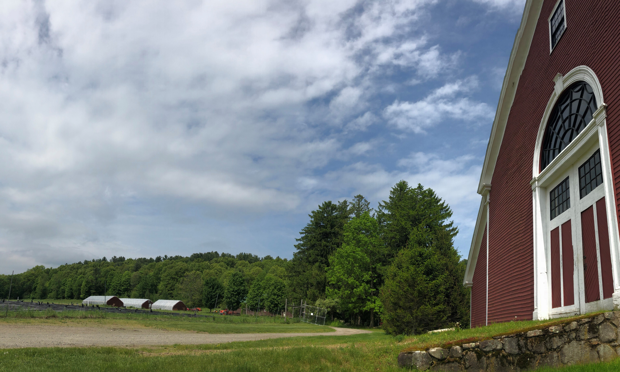 Farm Field with Red barn visible to the right